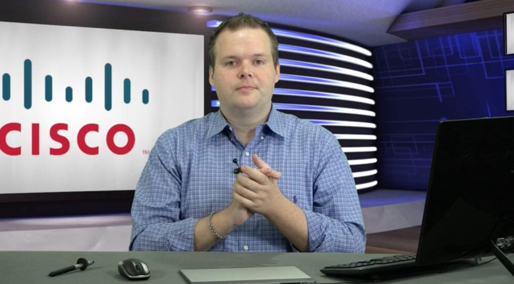 Professional Cisco instructor conducting a training session at AIIT.