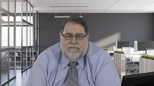 Professional man speaking at AIIT conference in modern office setting.