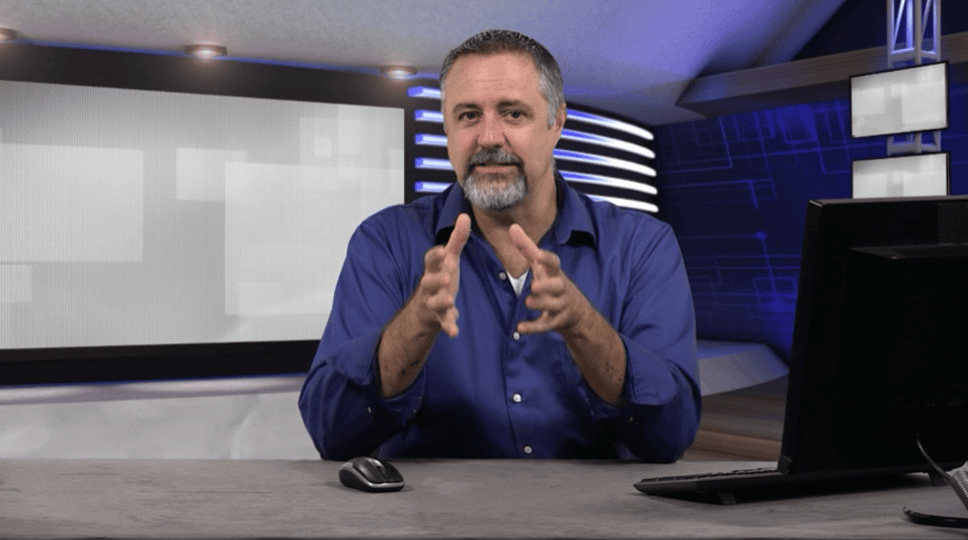 AIIT expert speaker presenting in a professional studio setting.